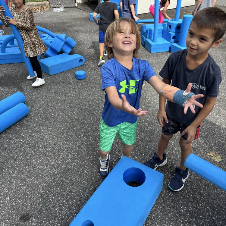 boys playing outdoor blocks
