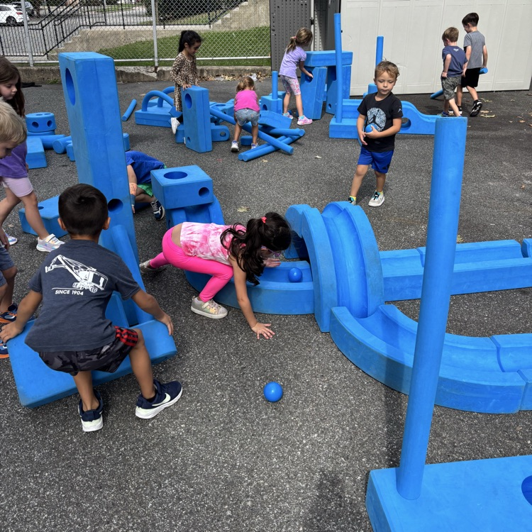 children building outdoor blocks