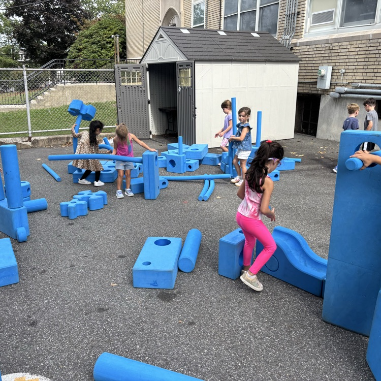 children building outdoor blocks