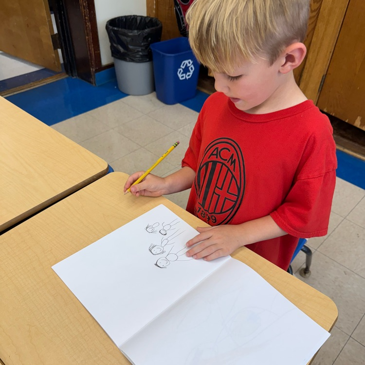 student drawing family