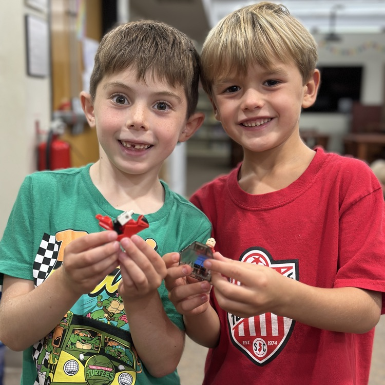 students showing their Lego jet skis