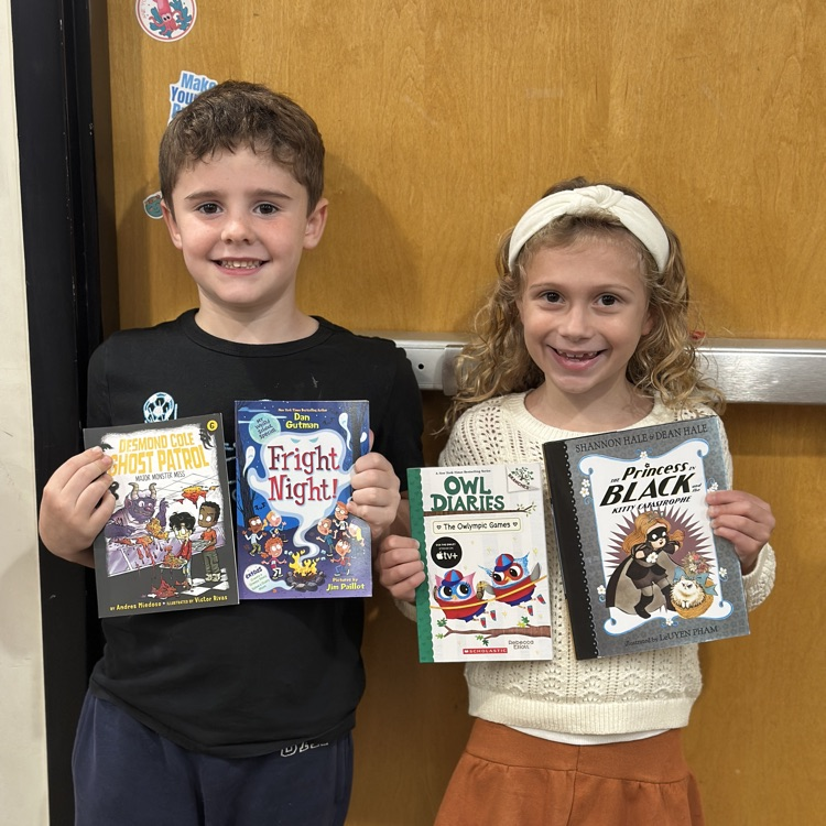 kids holding new books