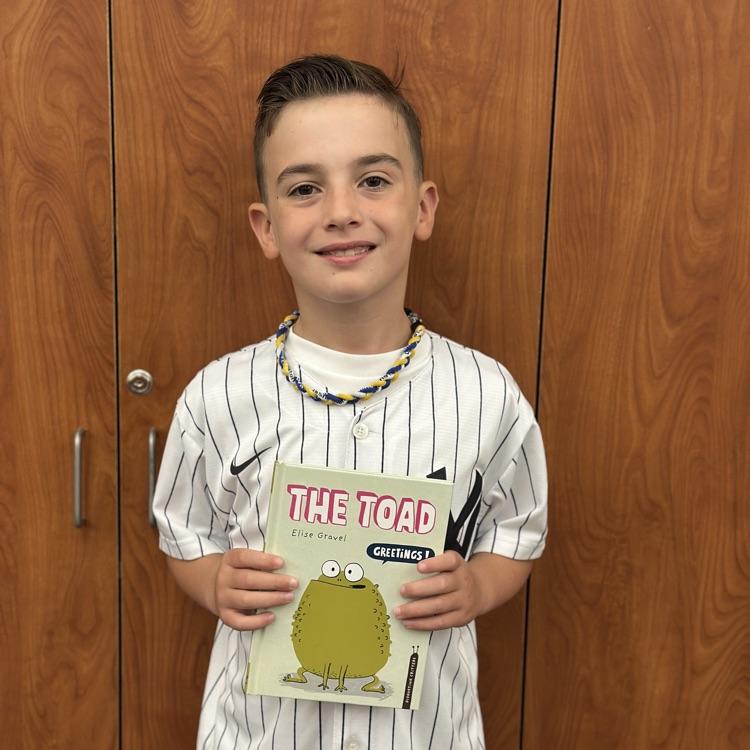 boy holding new book