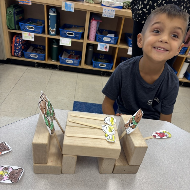 boy with blocks and puppets