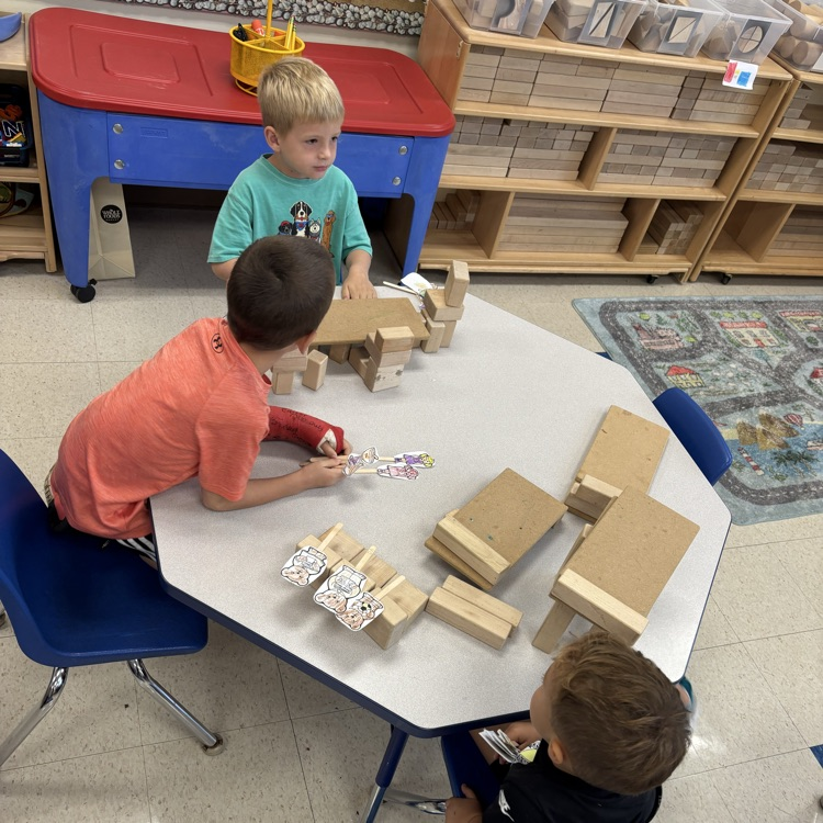 boys building with block