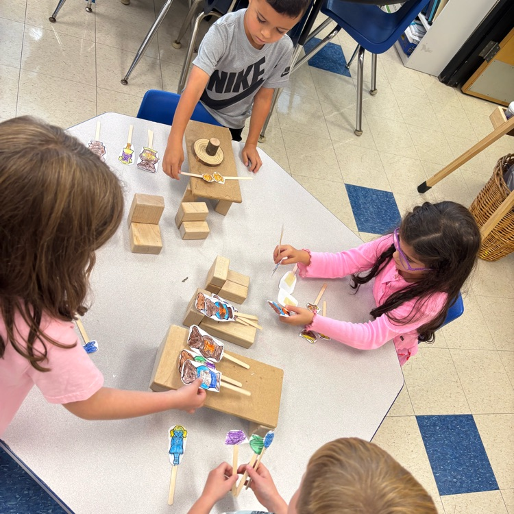 children building a set of the three bears with box