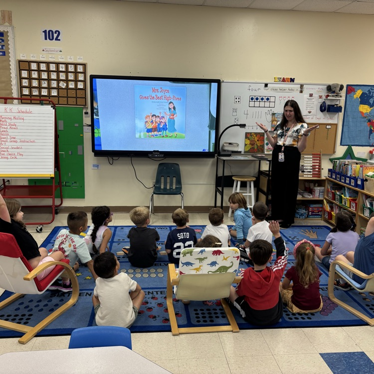 teacher speaking with children