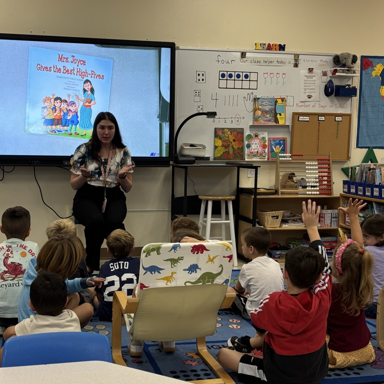 teacher speaking with children 