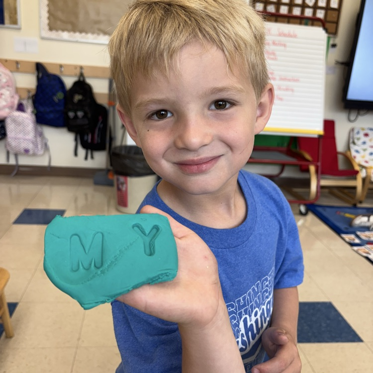 Little boy holding Play-Doh