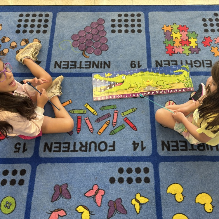 girls working on a puzzle