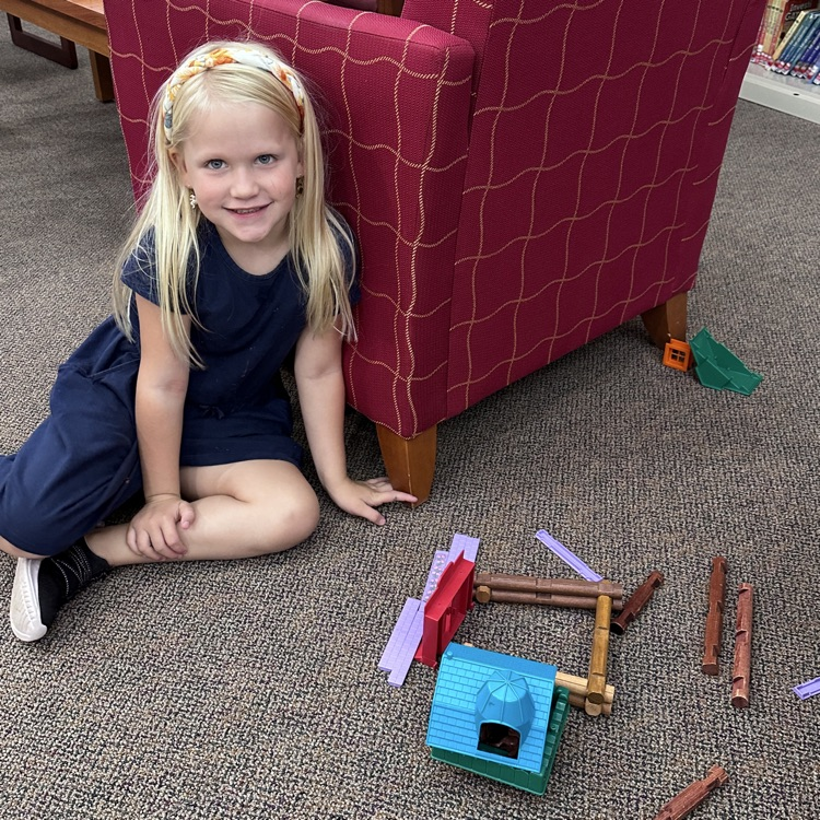student building with Lincoln logs 
