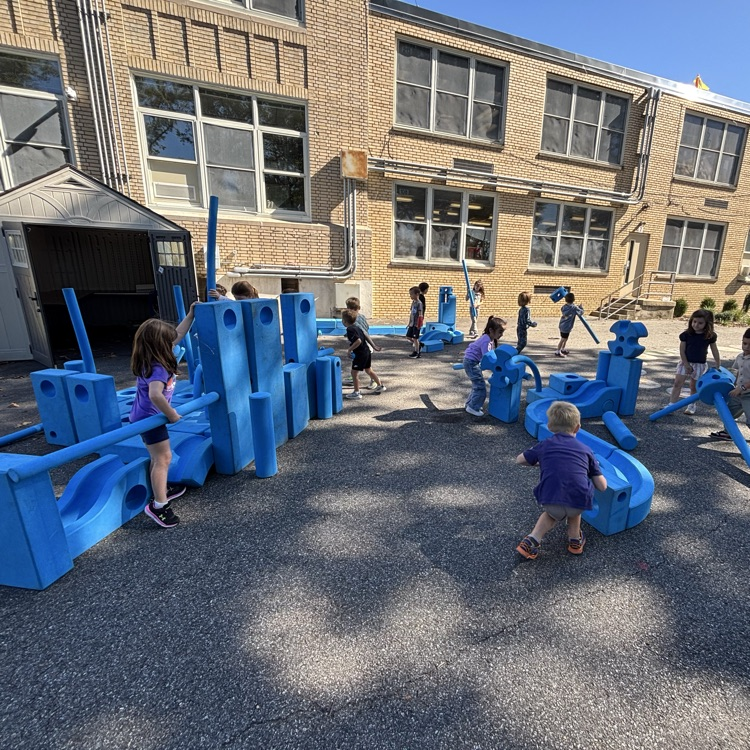 children playing with blocks outside