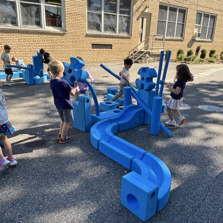 children playing with outdoor blocks