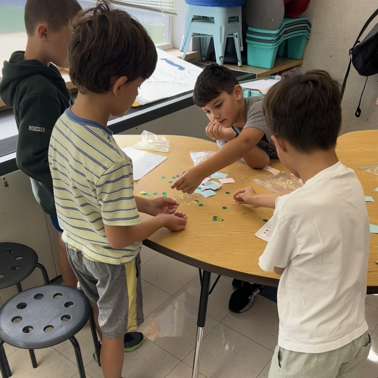 3LC practices adding by place value in rotating math stations