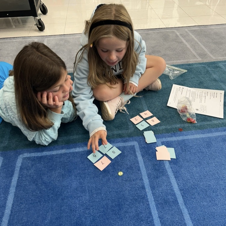 3LC practices adding by place value in rotating math stations 
