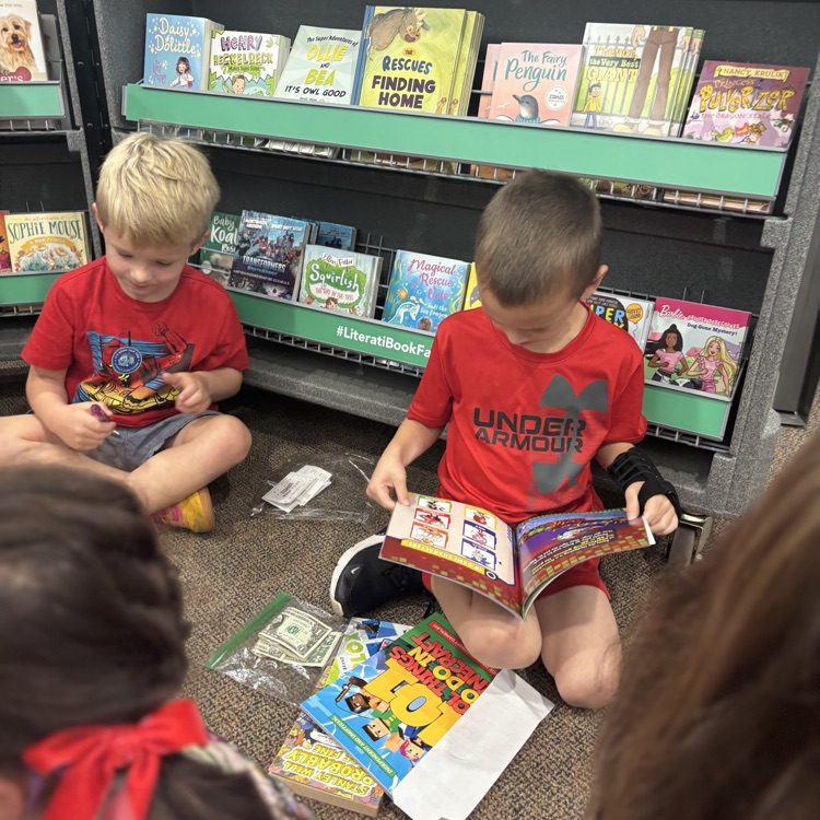 boys looking at books
