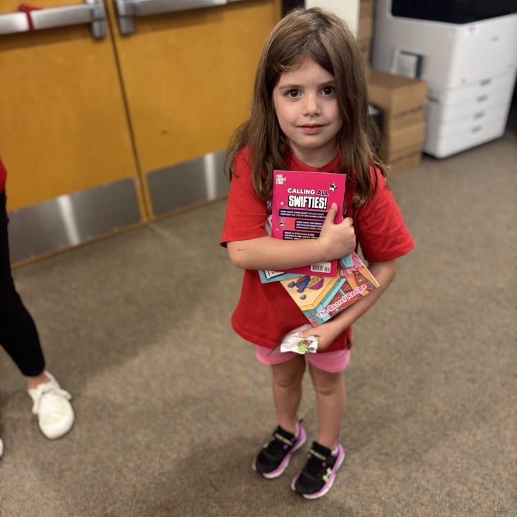 girl holding books