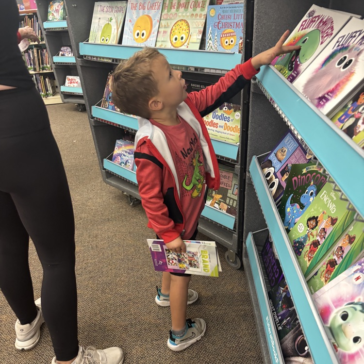 boy shopping for books