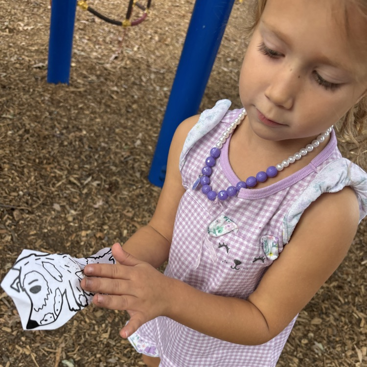 girl holding a puppet