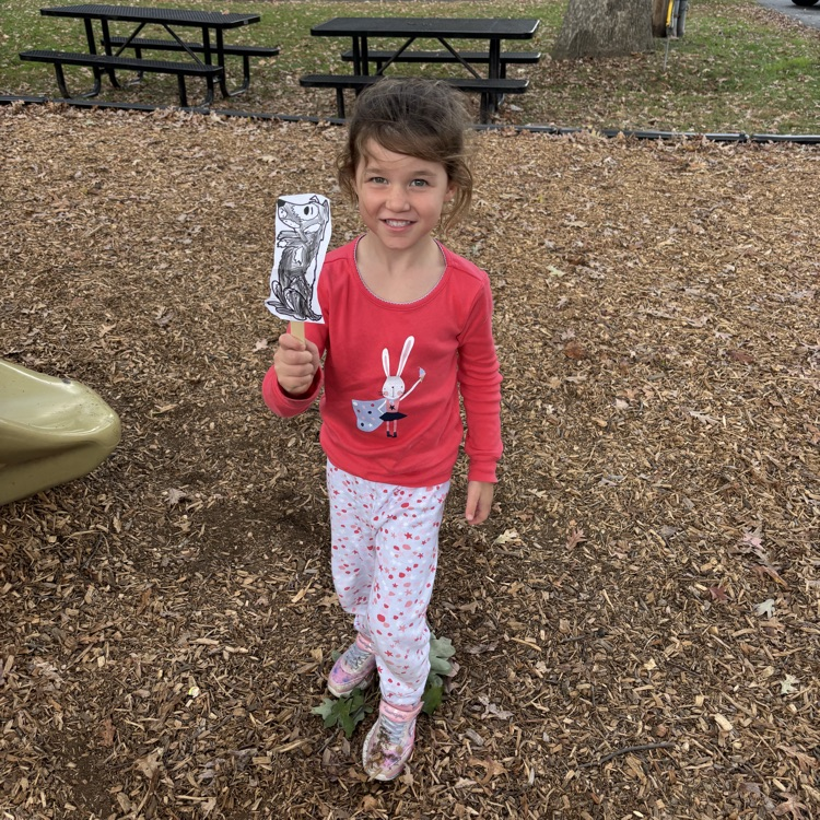 girl holding a puppet