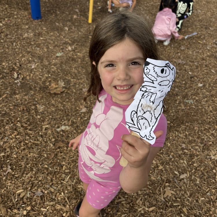 girl holding a puppet