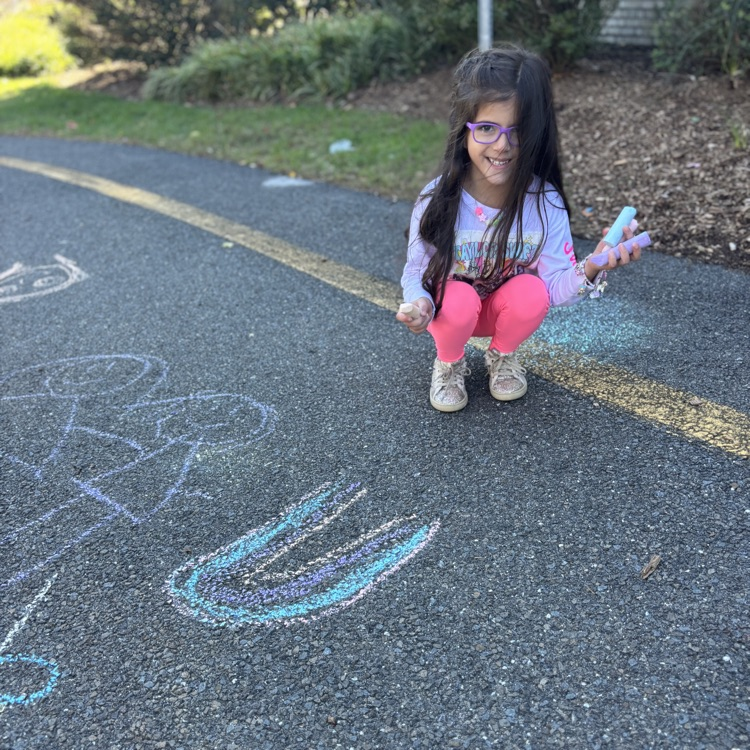 girl drawing a rainbow