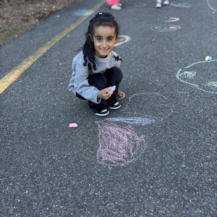 girl drawing hearts