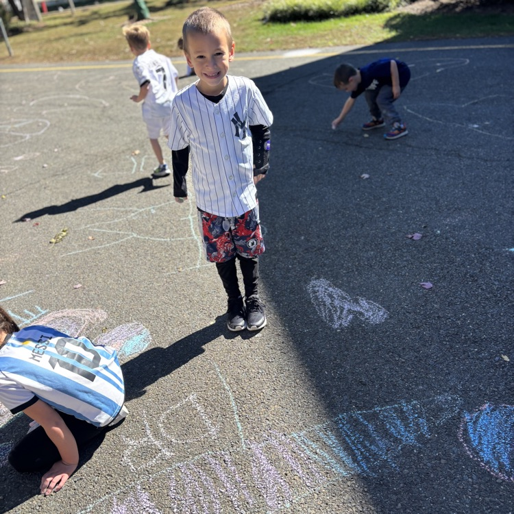 boy drawing with chalk