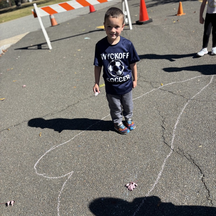 boy drawing big heart