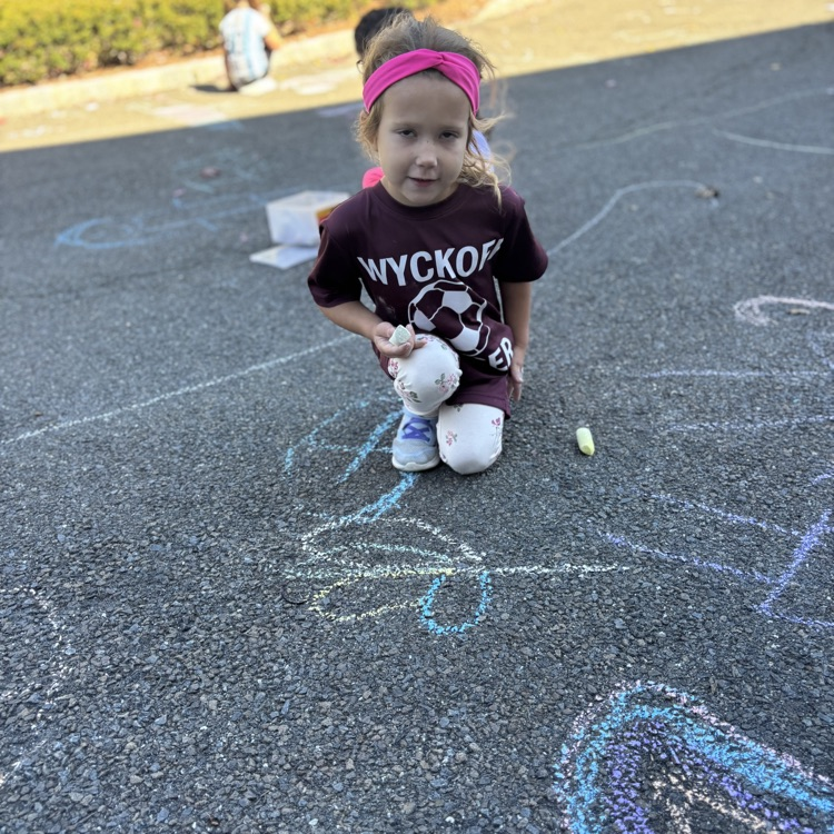 girl drawing a big heart