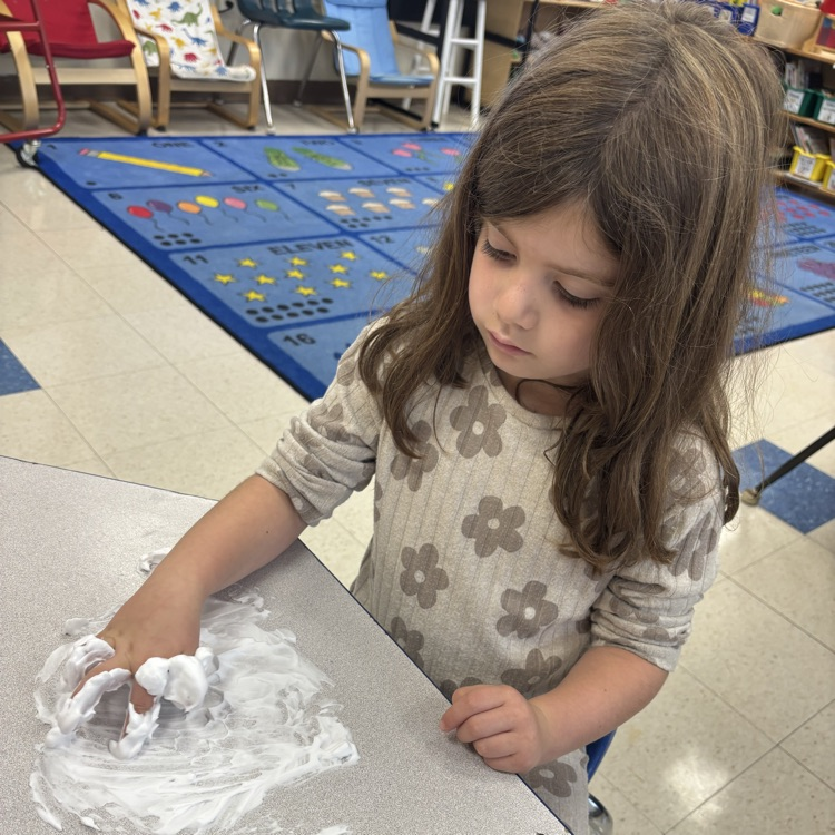 girl writing in shaving cream