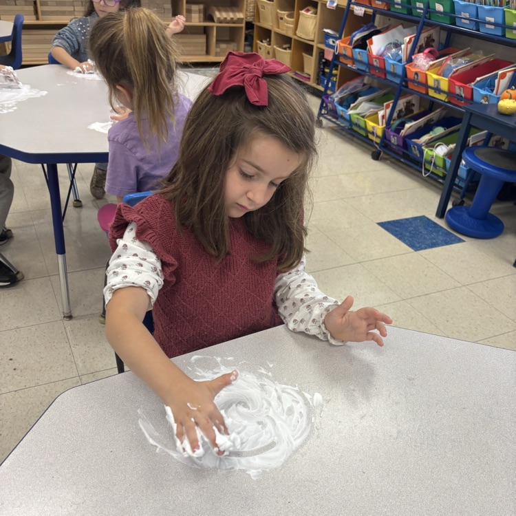 girl writing in shaving cream