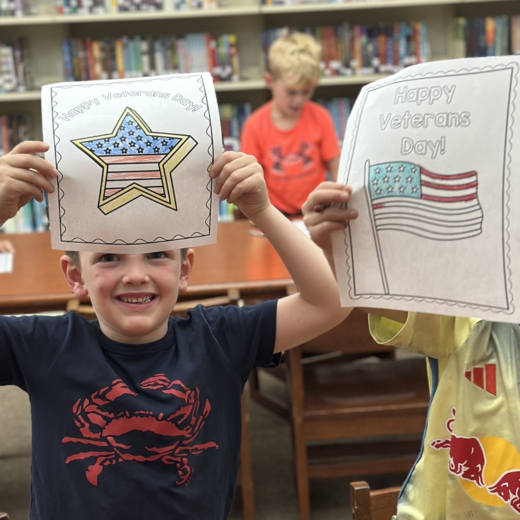 student holding Veterans Day picture
