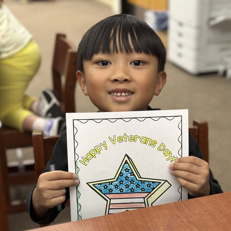 student holding Veterans Day picture
