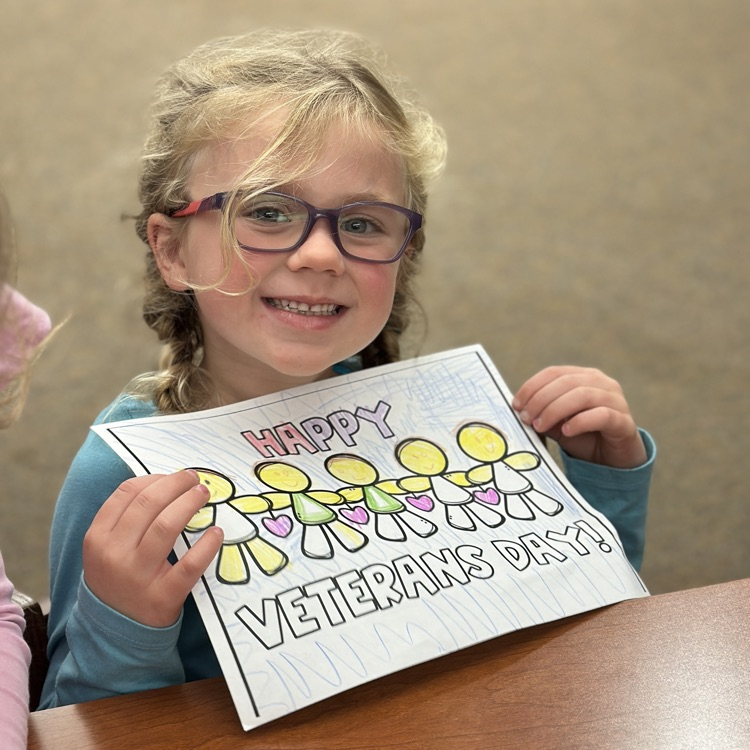 student holding Veterans Day picture