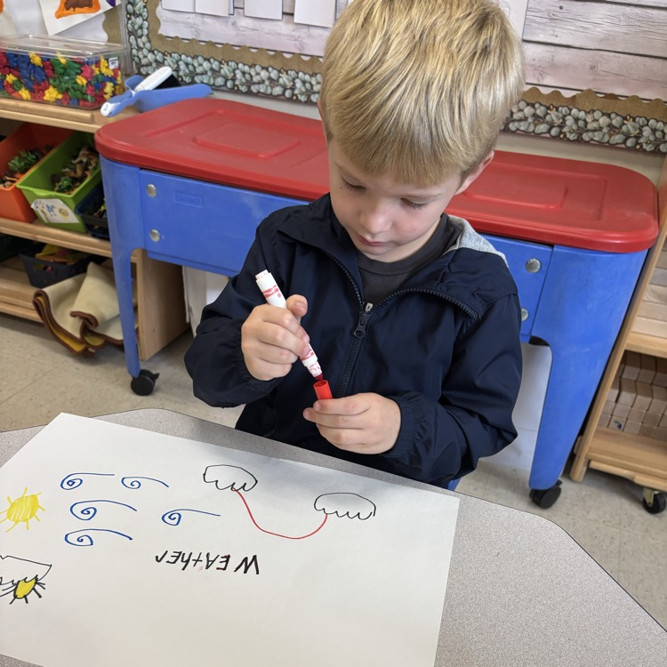 student drawing pictures