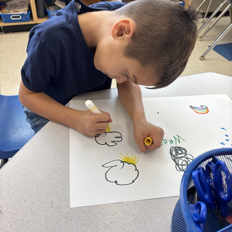 Student drawing pictures