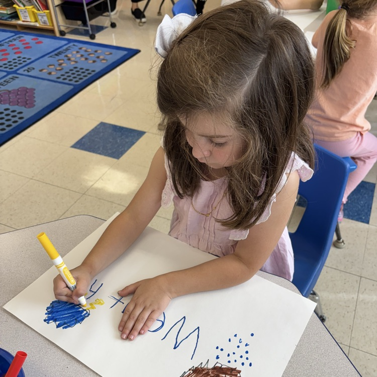 student drawing pictures