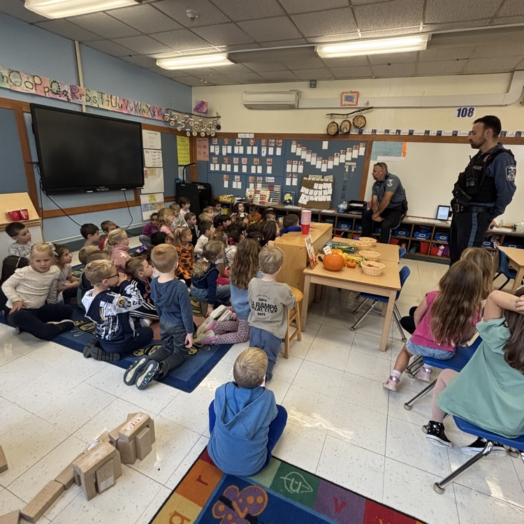 police officers speaking to children