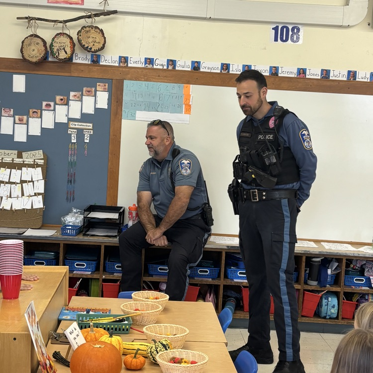 police officers speaking to children