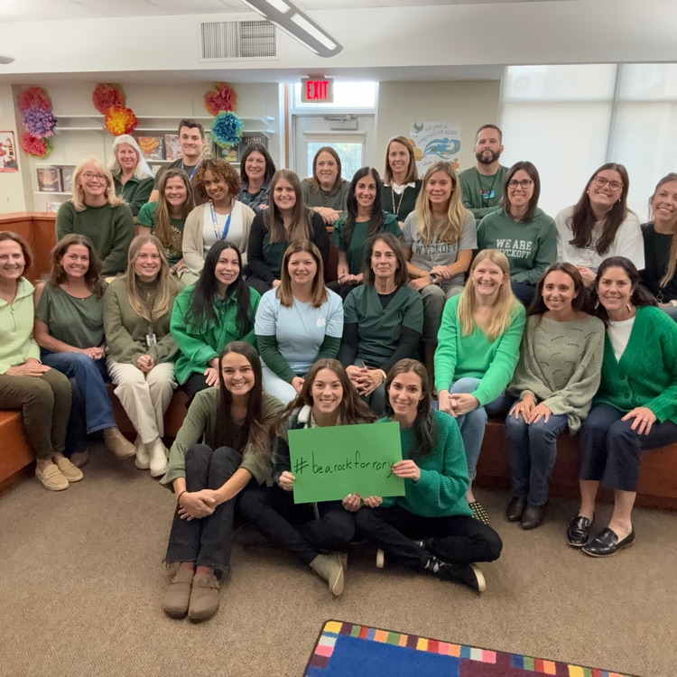 Washington school staff photo wearing green