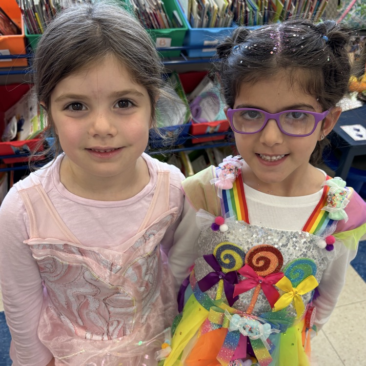 two girls dressed up for