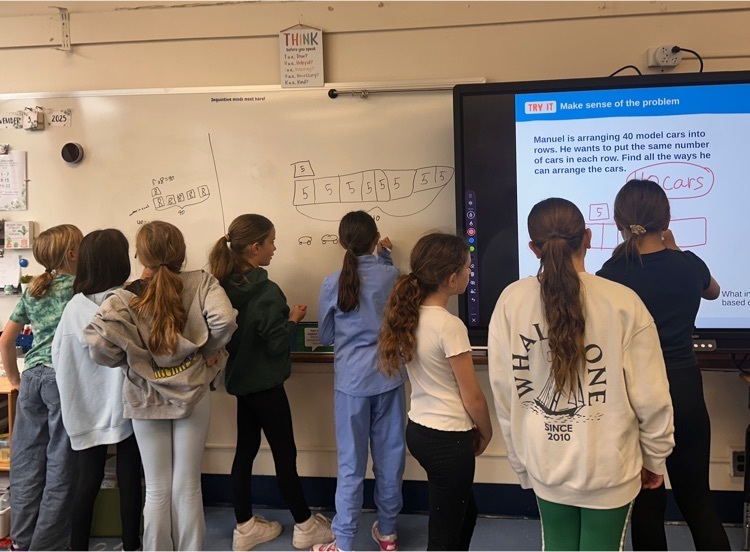 students working on whiteboard