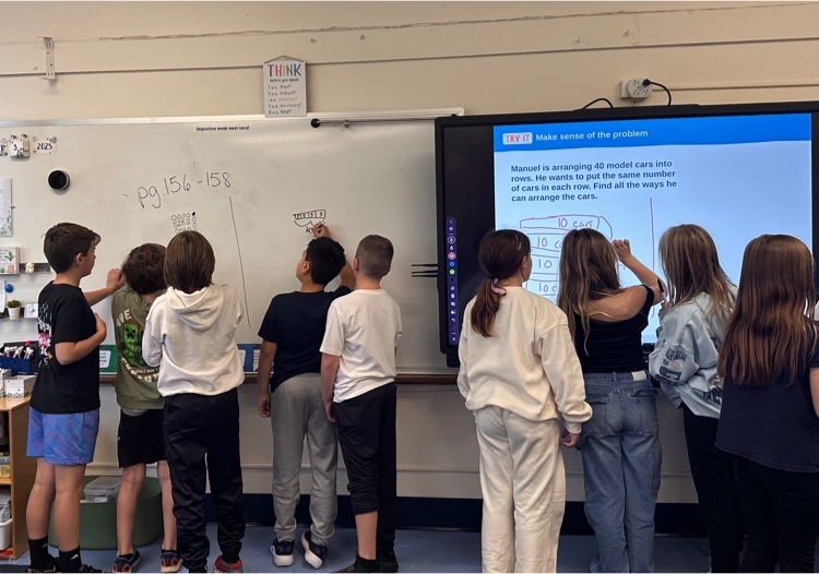 students working on whiteboard