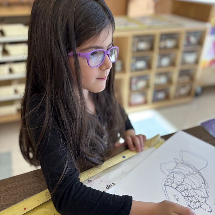 Child drawing a fish