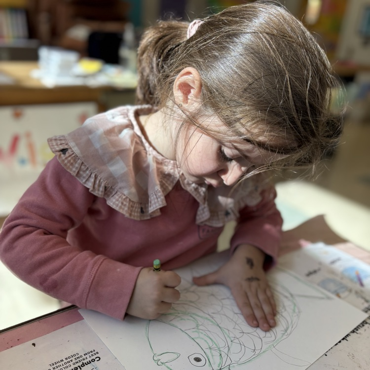 Child drawing a fish