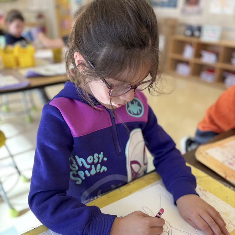 Child drawing a fish