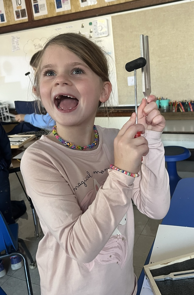 student experiments with a tuning fork