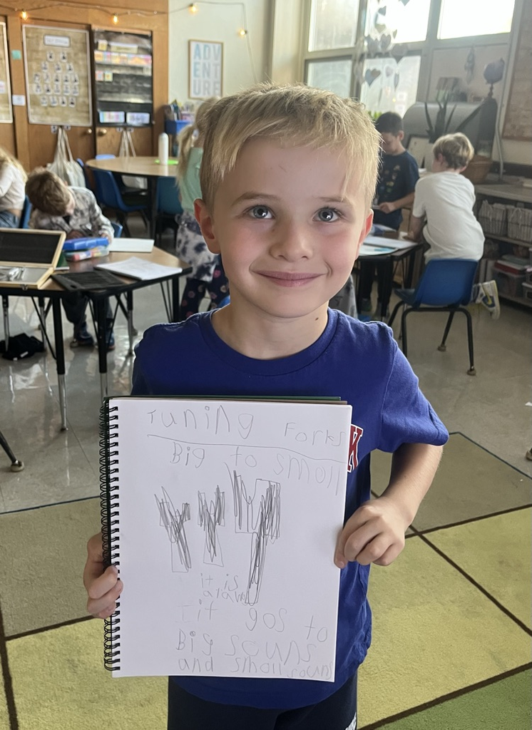 student holding a science notebook