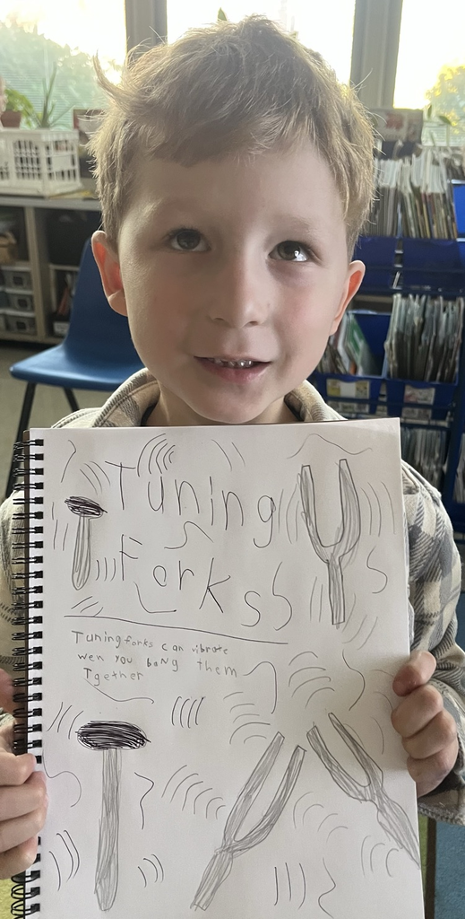 student holding science notebook